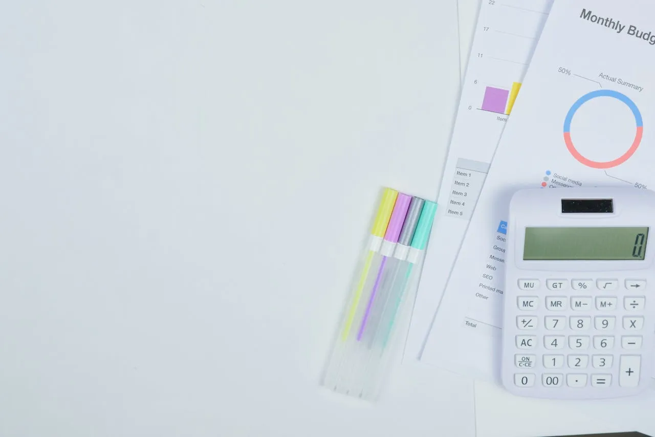 Professional workspace with renovation planning notes and laptop